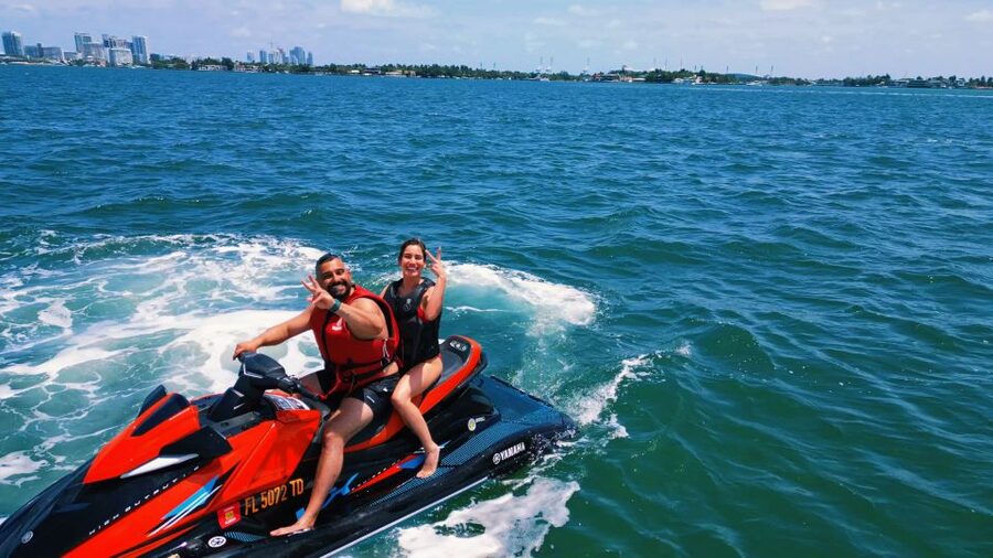Miami: Adventure Cruise with Jetski, Tubing, and Drinks - Taking the jet ski across the bay