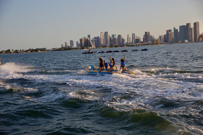 Miami Catamaran & Watersports: Jet Ski, Banana Boat & Drinks - Banana boat, towable tube, and floating mats